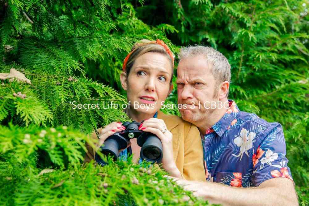 Secret Life Of Boys S03 All Icon Still Uncle Bob And Aunt Corey With Binoculars Landscape